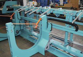 Self-lowering slings for collecting cut parts